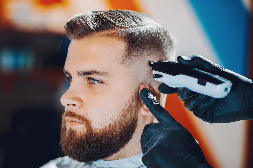 Sleek, modern hairstyle that highlights his sharp features.