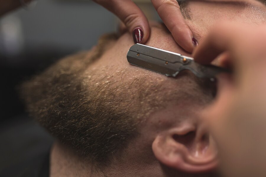 Perfectly groomed beard, styled to give him a distinguished look.